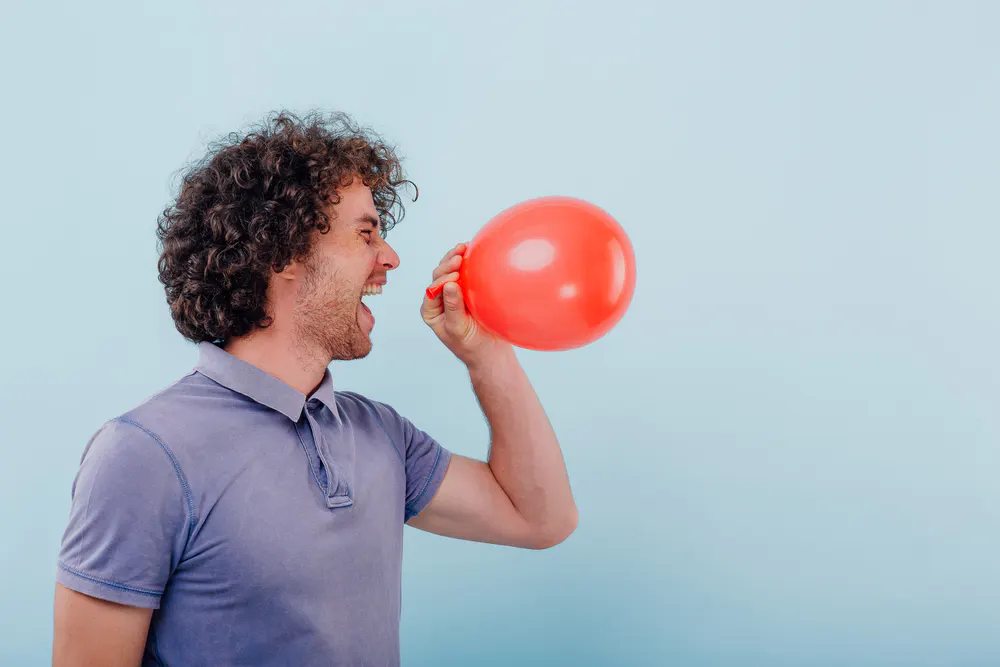 young-adult-inhaling-laughing-gas-from-a-balloon-subacute-combined-degeneration-short-lived-legal-highs-that-are-dangerous