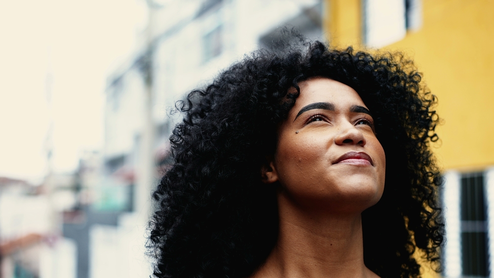 young-woman-believing-in-a-higher-power-without-being-religious-struggle-with-addiction-SMART-recovery-mindfulness-meditation